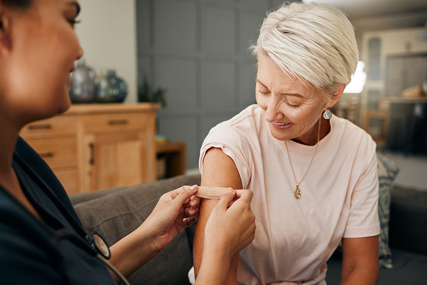 Covid vaccine, plaster and doctor with patient