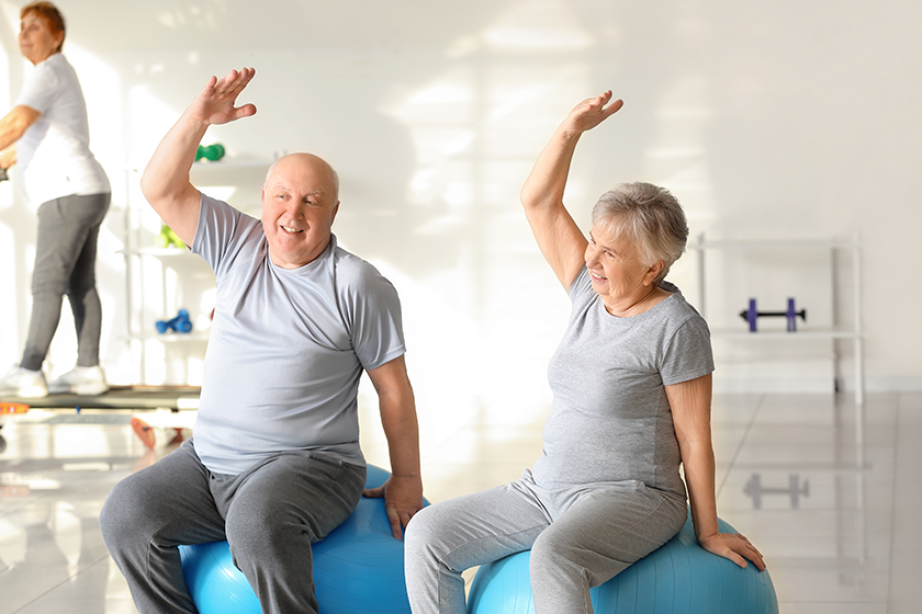 elderly-man-woman-exercising-gym