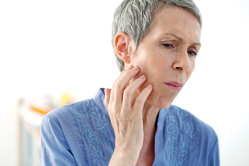 ELDERLY PERSON WITH A TOOTHACHE 