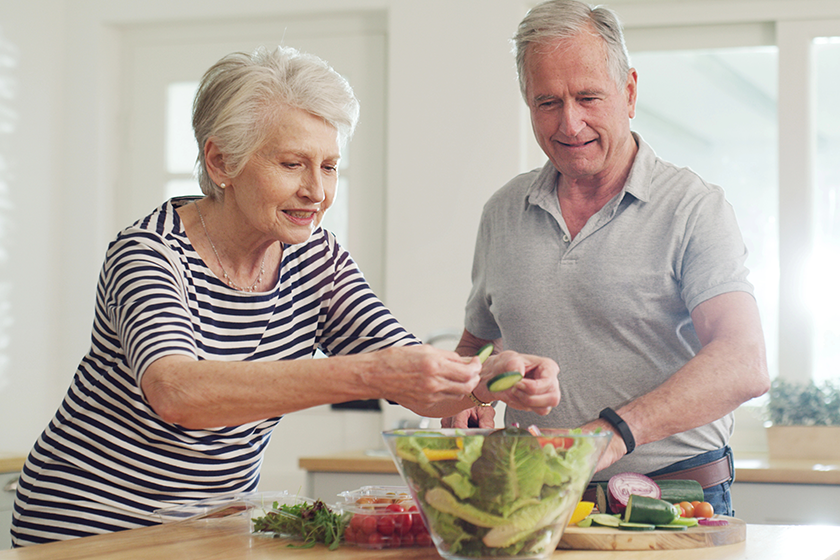 have-little-everything-salad-happy-senior-couple-preparing-salad-together