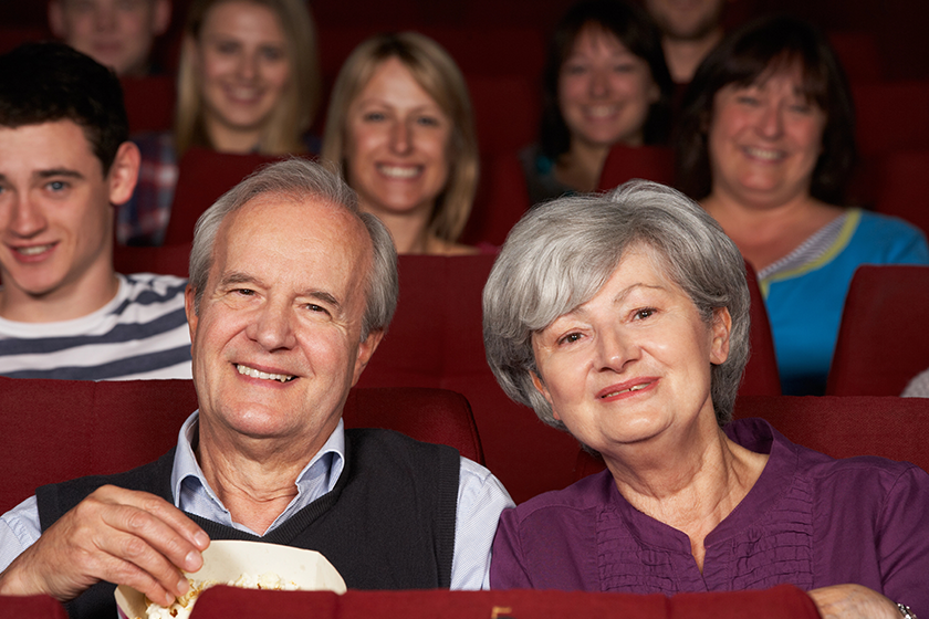 senior-couple-watching-film-in-cinema