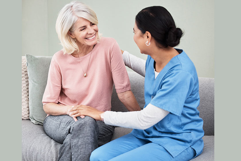 Shot of a female nurse sitting with a senior patient